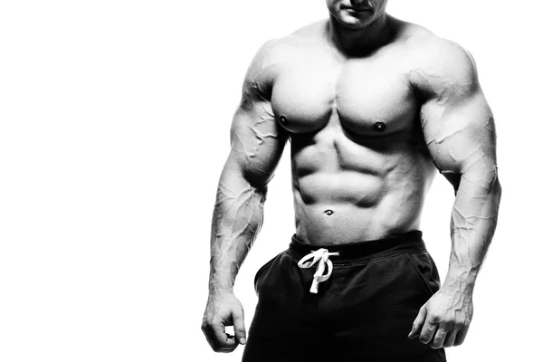 Bellissimo bodybuilder muscolare che si prepara per il fitness training . — Foto Stock