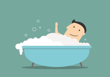 Businessman relaxing in bathtub with foam