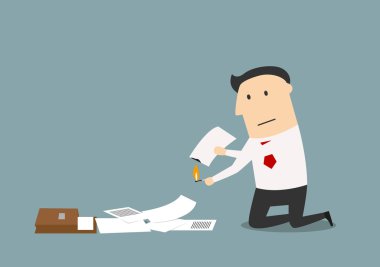 Businessman burning up a business documents