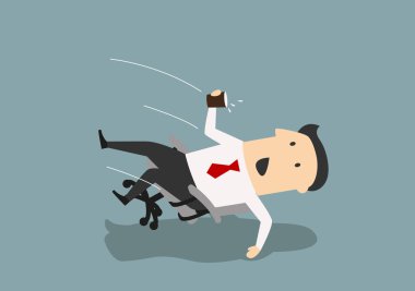 Businessman in an office chair falls backwards 