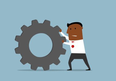 Unhappy businessman pushing a gear wheel