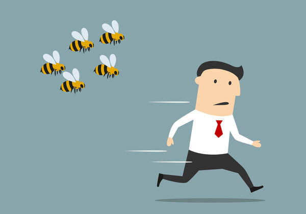 Businessman running away from angry bees
