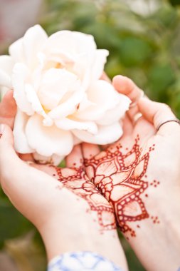 Mehndi tattoo. Woman Hands with black henna tattoos. India natio