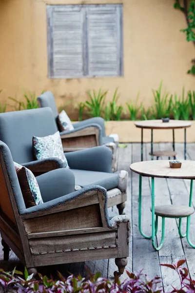 Outdoor patio seating with nice bench chairs at sunset — Stock Photo, Image