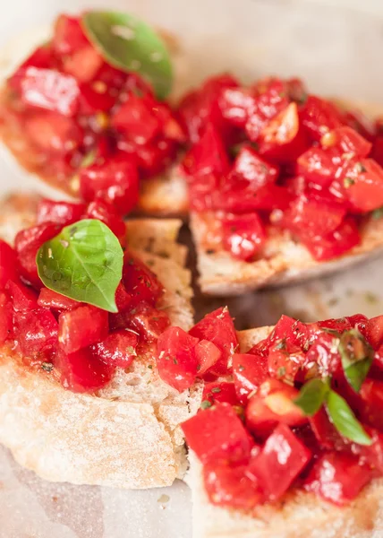 Italian tomato bruschetta with chopped vegetables, herbs and oil — Stock Photo, Image