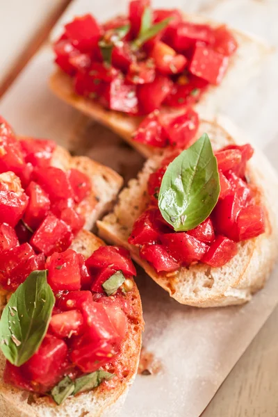 Italian tomato bruschetta with chopped vegetables, herbs and oil — Stock Photo, Image