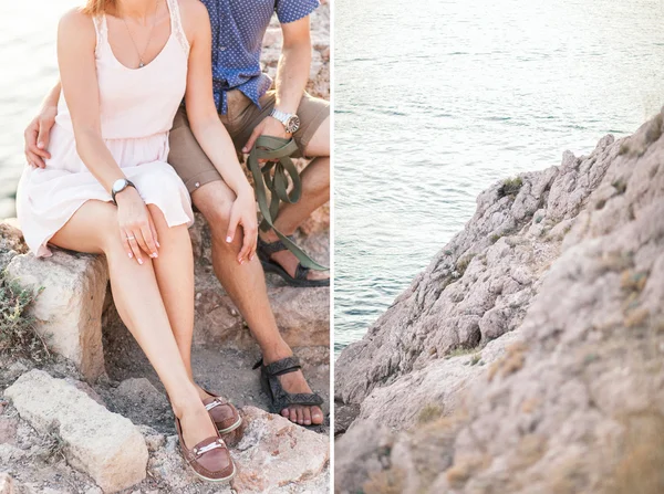 Par killar leker med sin hund på berget nära havet. Romantisk tid i naturen med vacker utsikt. — Stockfoto