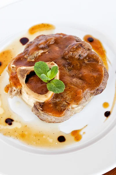 Fresh grilled beef steak on white plate close up — Stock Photo, Image