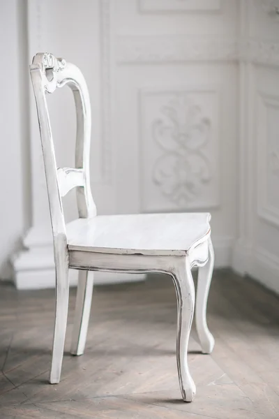 White Wooden Vintage Chair Standing in front of a White Wall on — Stock Photo, Image