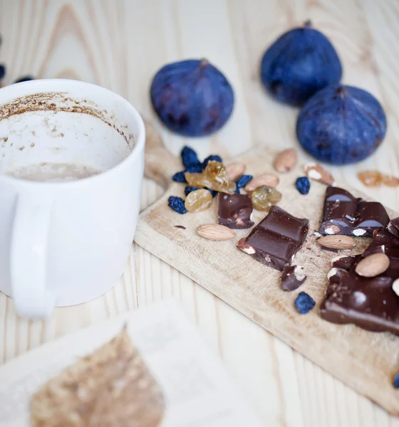 Cup of coffee with book and chocolate — Stock Photo, Image