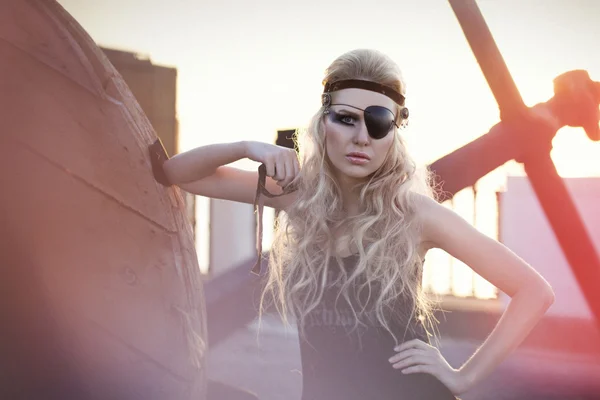 Fashion woman with long blond hair, make up and eye-patch — Stock Photo, Image