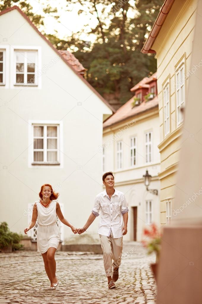 Couple in Prague, Czech Republic, Europe. Happy young couple walking outside in old town.