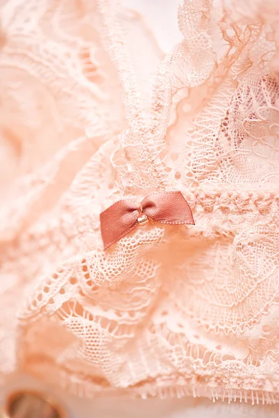 Tenderness peachys lingerie with roses petails, candle and accessories. Love mood. — Stock Photo, Image