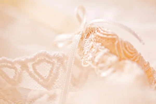 Tenderness peachys lingerie with candle and motif. Love mood. — Stock Photo, Image