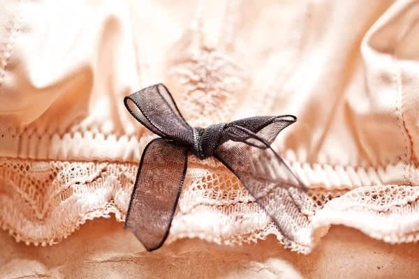 Tenderness peachys lingerie with candle and dry petals. Love moo — Stock Photo, Image