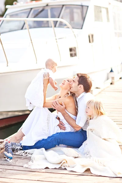 Happy family having fun walking on the mooring near yachts — Stock Photo, Image