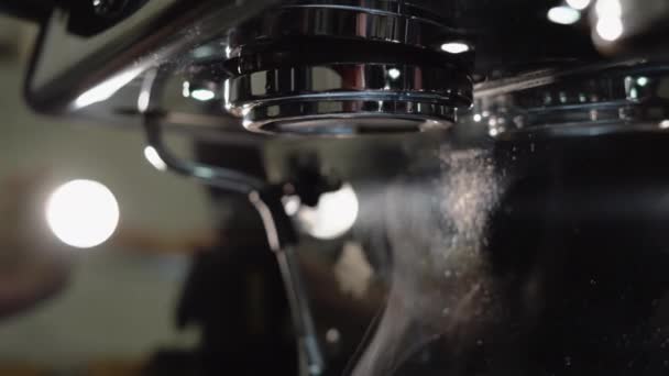 The process of making fresh coffee. Hot water is pouring out of the coffee machine. — Stock Video
