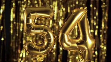 Altın 54 numara sarı zemin üzerinde şişme bir balondan yapılmıştır. Tam sayı kümelerinden biri. Doğum günü, yıldönümü, tarih kavramı