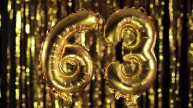 63 numara 63 sarı zemin üzerinde şişme balondan yapılmıştır. Tam sayı kümelerinden biri. Doğum günü, yıldönümü, tarih kavramı