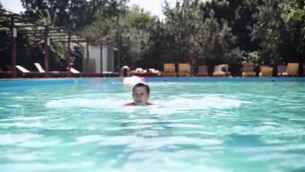 Portrait of a handsome man by the pool while on vacation at the resort at the hotel. — Stock Video