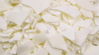 Bitki dokusunu ve doğal maddeleri vurgulayan büyük, kuru soya dokulu balmumu parçaları. arkaplan