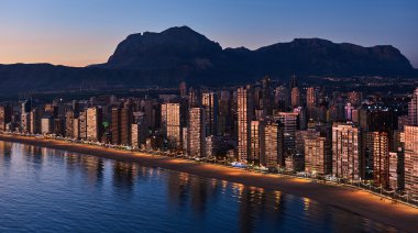 Aerial view of a Benidorm city coastline at sunset. Spain clipart