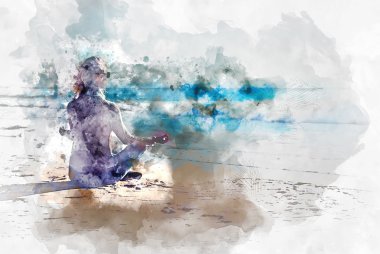 Genç bir kadın sahilde meditasyon yapıyor.