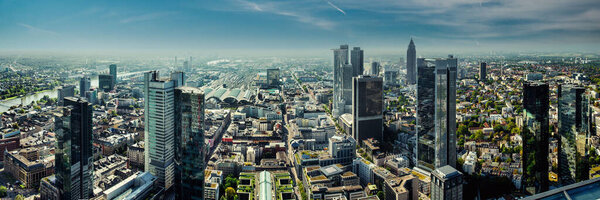 Panoramic view of Frankfurt am Main cityscape and blue sky. Modern architecture business downtown. Europe. German
