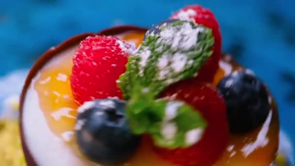 Spinning Plate Mousse Chocolate Hemisphere Mould Decorated Fresh Raspberries Blueberries — Stock Video