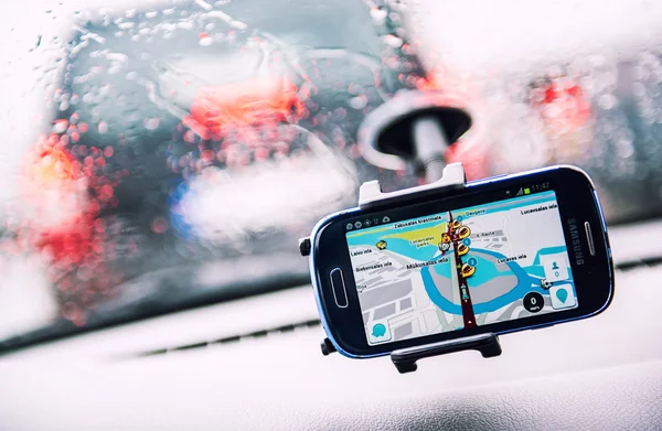 Smart phone with a Waze GPS navigator on the screen — Stock Photo, Image