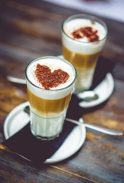 Cappuccino with a chocolate heart — Stock Photo, Image