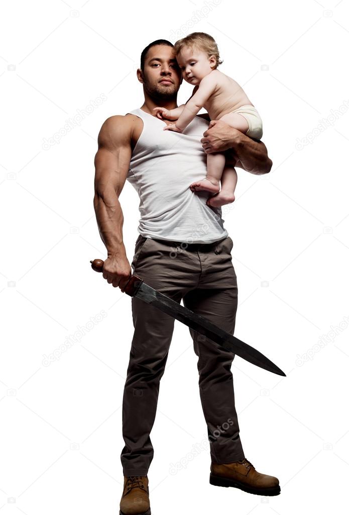 Father hugging a baby and holding a sword