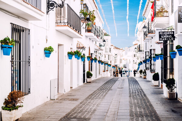 Mijas, Spain- January 05, 2014: Charming whitewashed street In Mijas. Mijas is a lovely Andalusian white village on the Costa del Sol. Spain