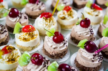 Delicious small fancy cakes clipart