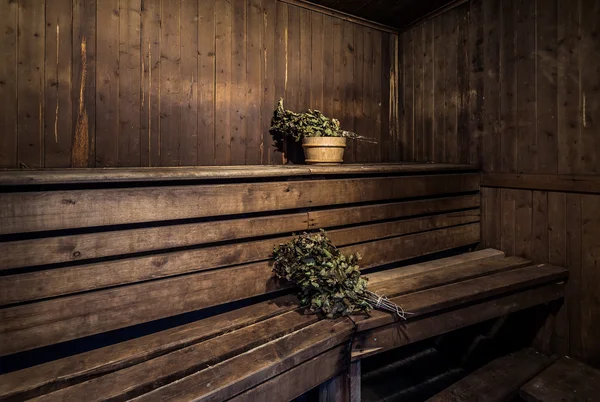 Oak brooms inside of a bath house — Stock Image Oak brooms inside of a bath house Stock Photo