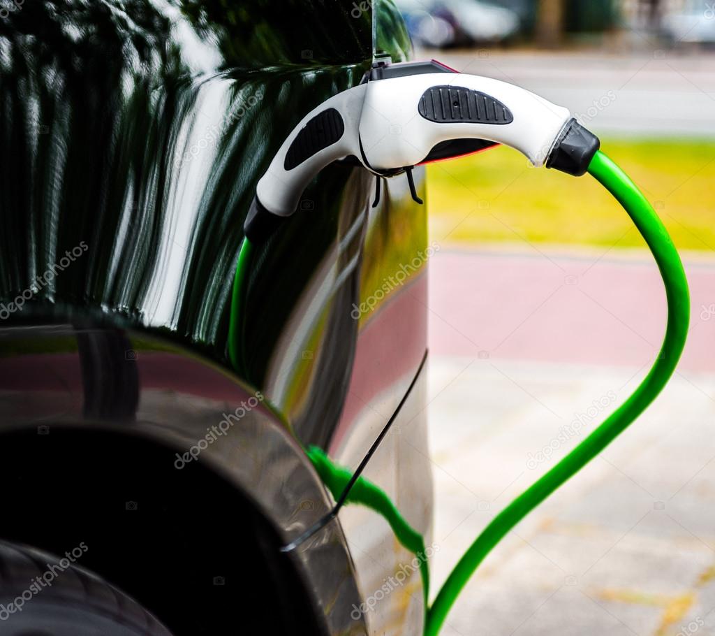 Electric car charging in EV charging station — Stock Photo © amoklv
