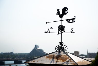 Rooster weather vane in Riga, Latvia. Northern Europe clipart
