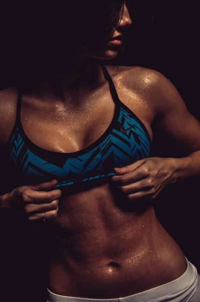 Athletic girl. Close-up of a abs with drops of water — Stock Photo, Image