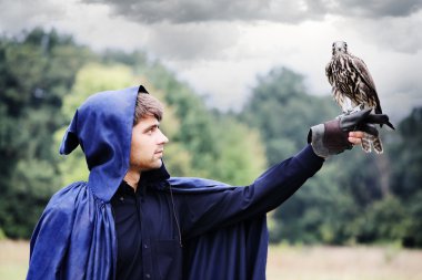 man holding a falcon clipart