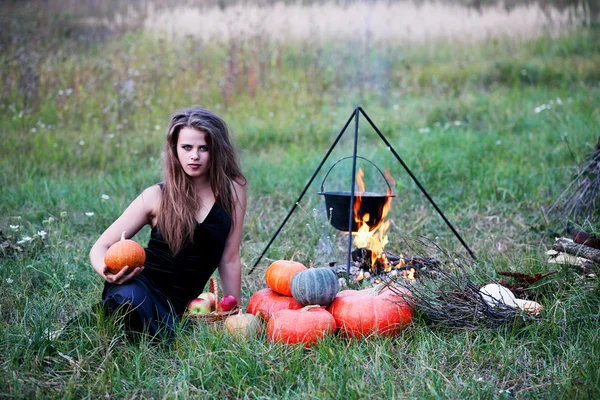 Witch with pumpkins — Stock Photo, Image