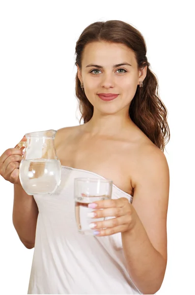 Mulher segurando um jarro de água e um copo — Fotografia de Stock