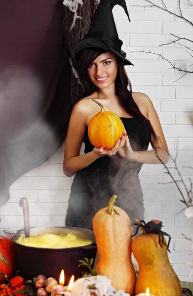 Witch with a pumpkin — Stock Photo, Image