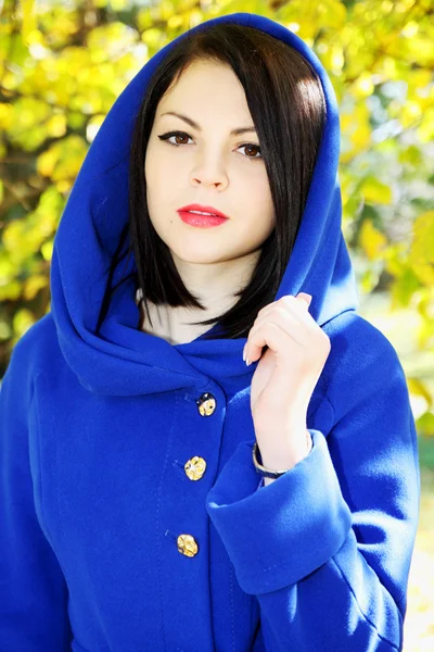 Women in a blue coat — Stock Photo, Image