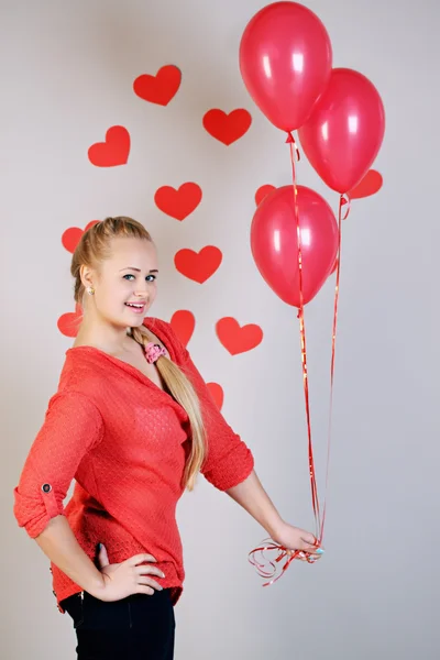 Mujer sosteniendo tres globos —  Fotos de Stock