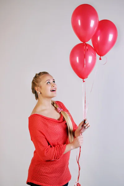 Blonde holding three balloons — Stock Photo, Image