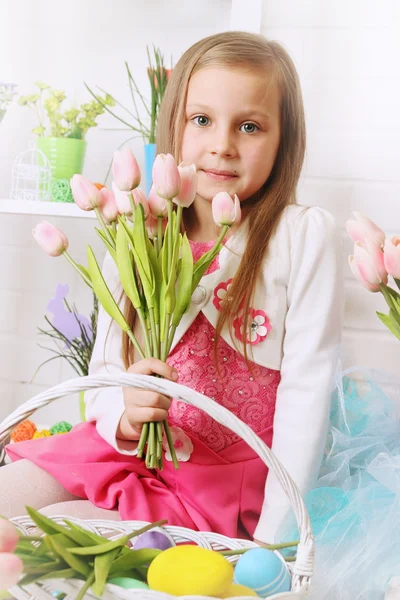 Girl with a bouquet of tulips — Stock Photo, Image