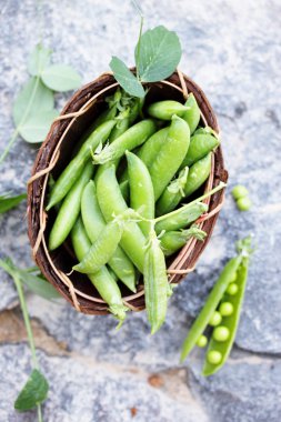 peas on a stone, top view clipart