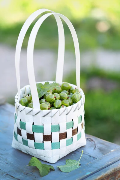 Gooseberries in basket — Stock Photo, Image