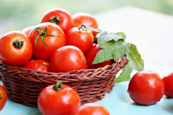 Tomatoes in a basket — Stock Photo, Image