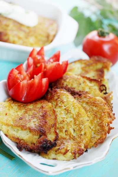 Pancakes potato with tomatoes — Stock Photo, Image